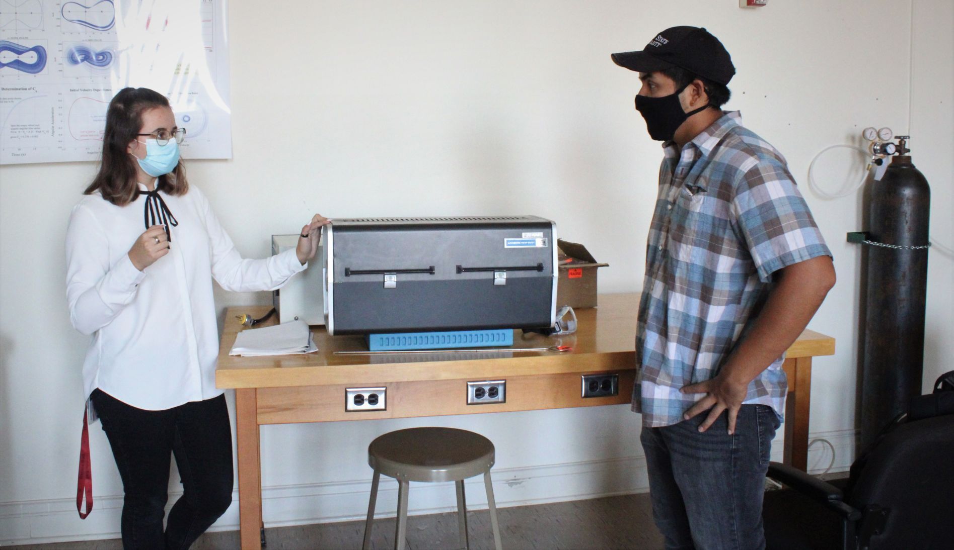 Students discuss nanoparticle furnace